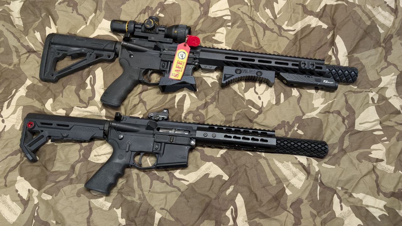 Selection of AR15 rifles with various optics